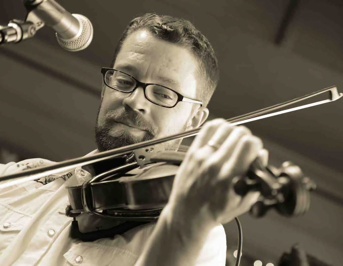 Andy Lentz playing fiddle on stage